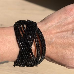 Black beaded adjustable bracelet.